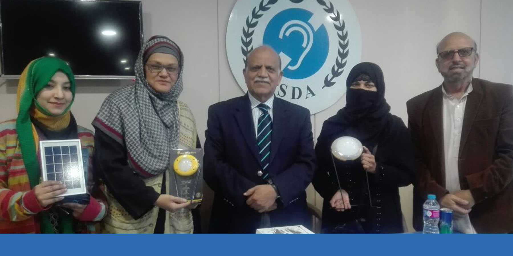 Mr Zaigham Mahmood Rizvi with SDA president introducing solar lamp to deaf community