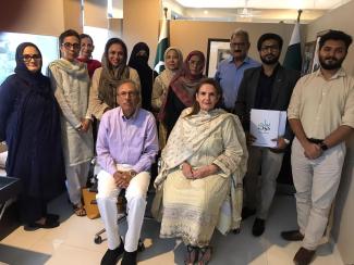 Dr. Alvi and Samina Alvi with team of Boltay Huroof